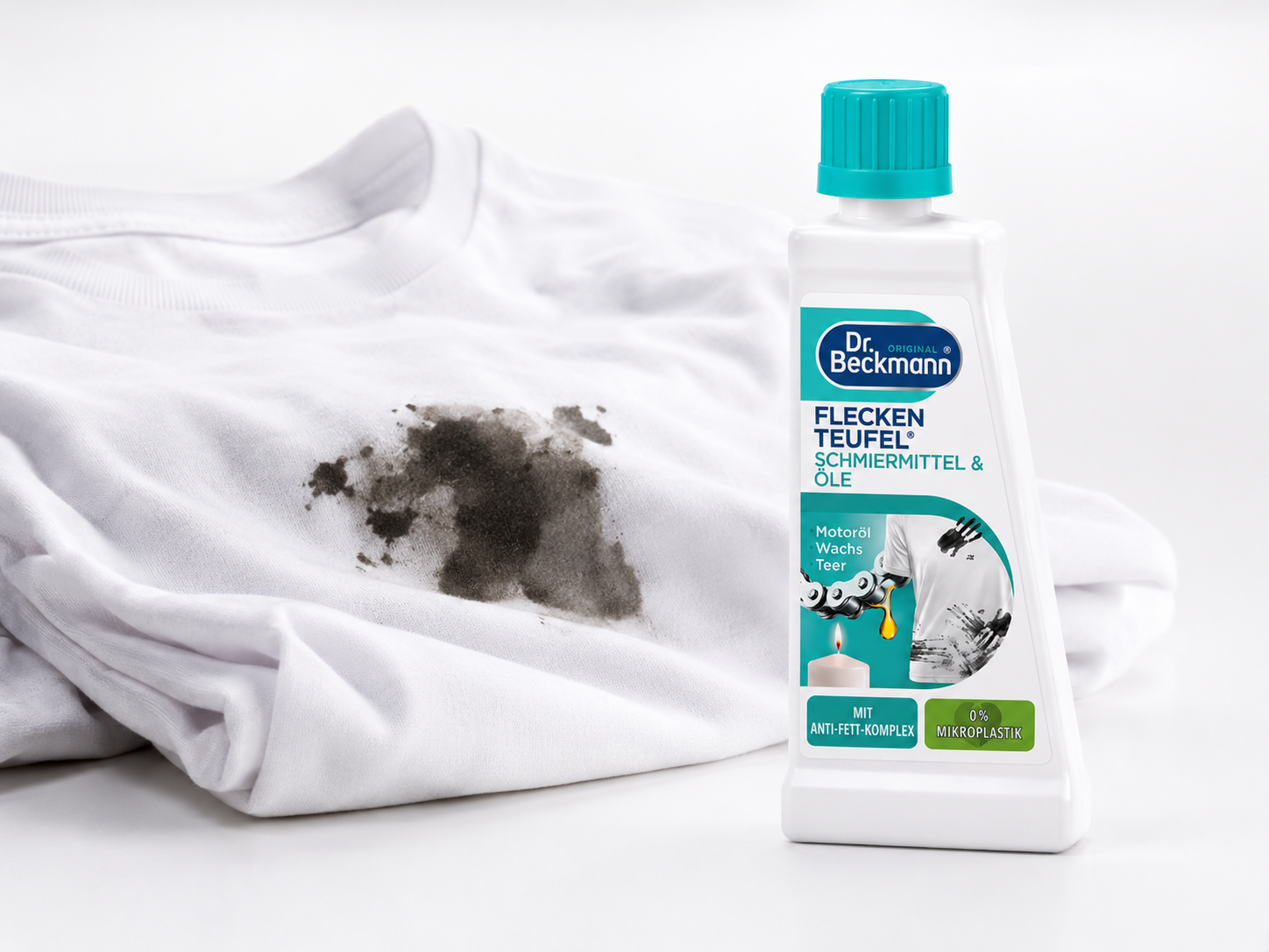 Dr. Beckmann vlekverwijderaar naast witte kleding met olie- en vetvlek voor gerichte vlekbehandeling